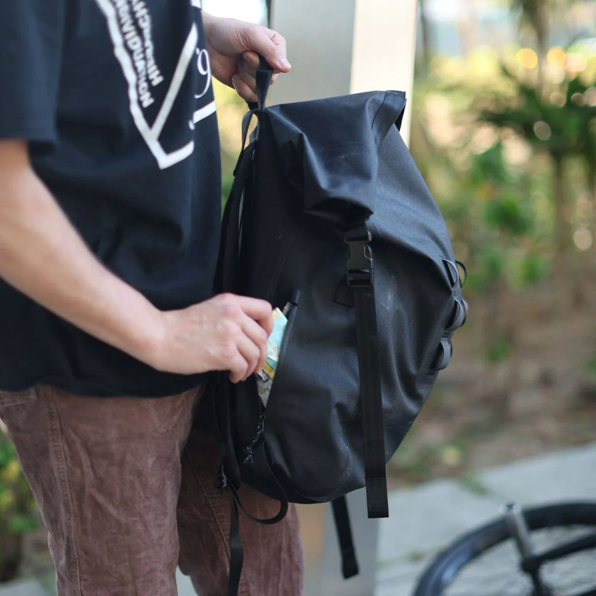 Chrome Industries Urban Ex Rolltop 30L Backpack in Black — lifestyle