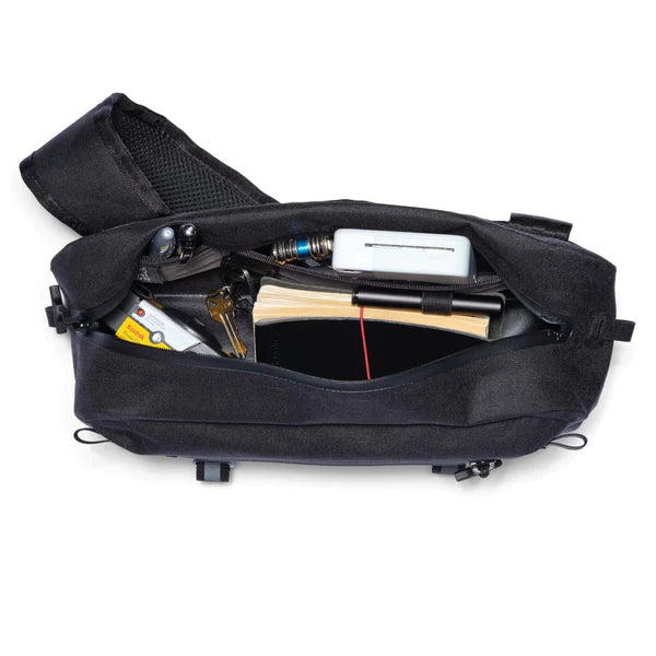 Chrome Industries Mini Kadet WP 5L sling bag – black colorway, open flat showing the contents