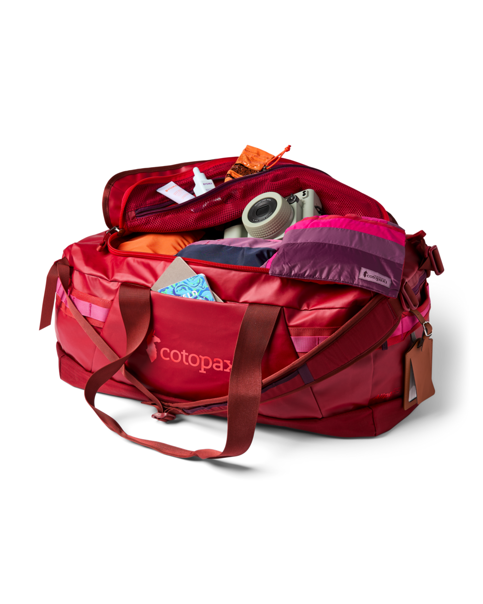 Cotopaxi Allpa Getaway 55L Duffel in Crimson — angle view 2