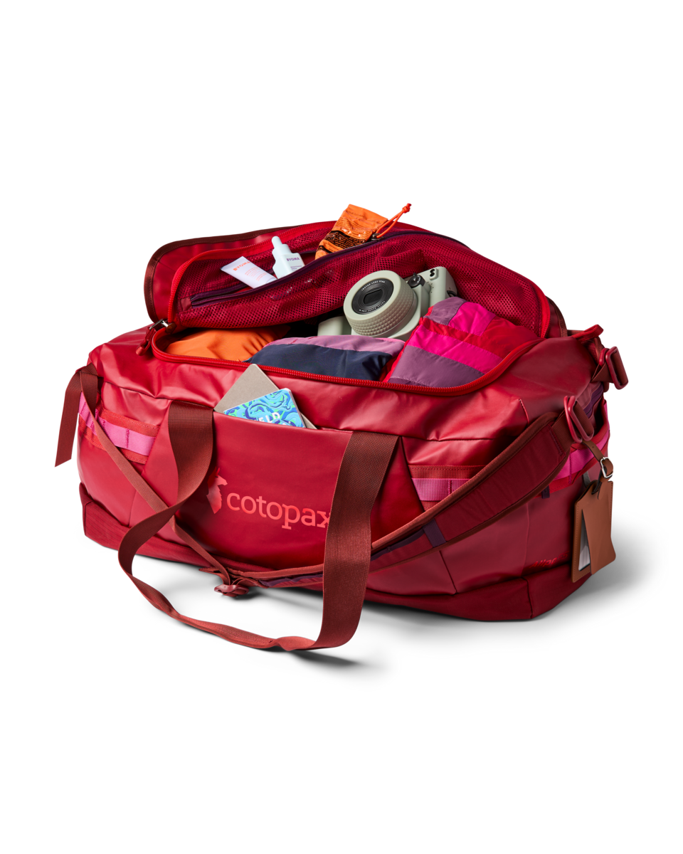 Cotopaxi Allpa Getaway 55L Duffel in Crimson — angle view 3