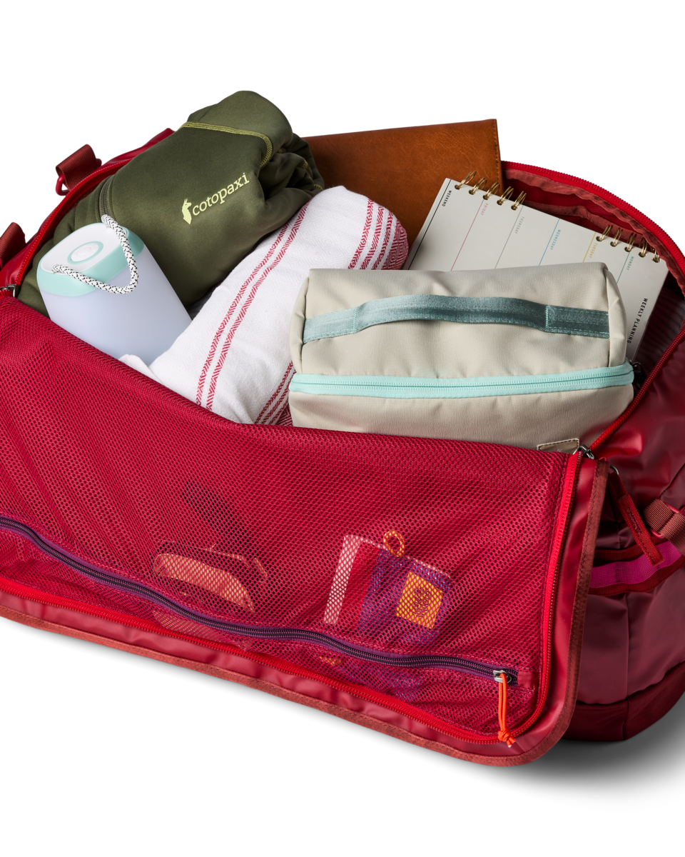 Cotopaxi Allpa Getaway 70L Duffel in Crimson — angle view 2