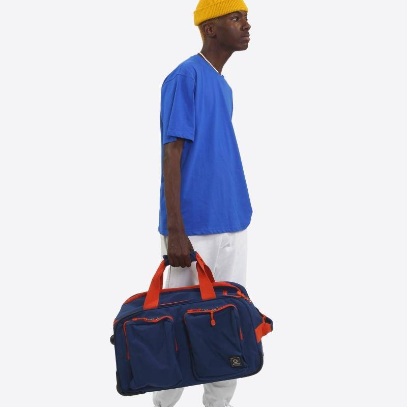 J World Duane Rolling Duffel Bag in Navy — lifestyle # color_Navy