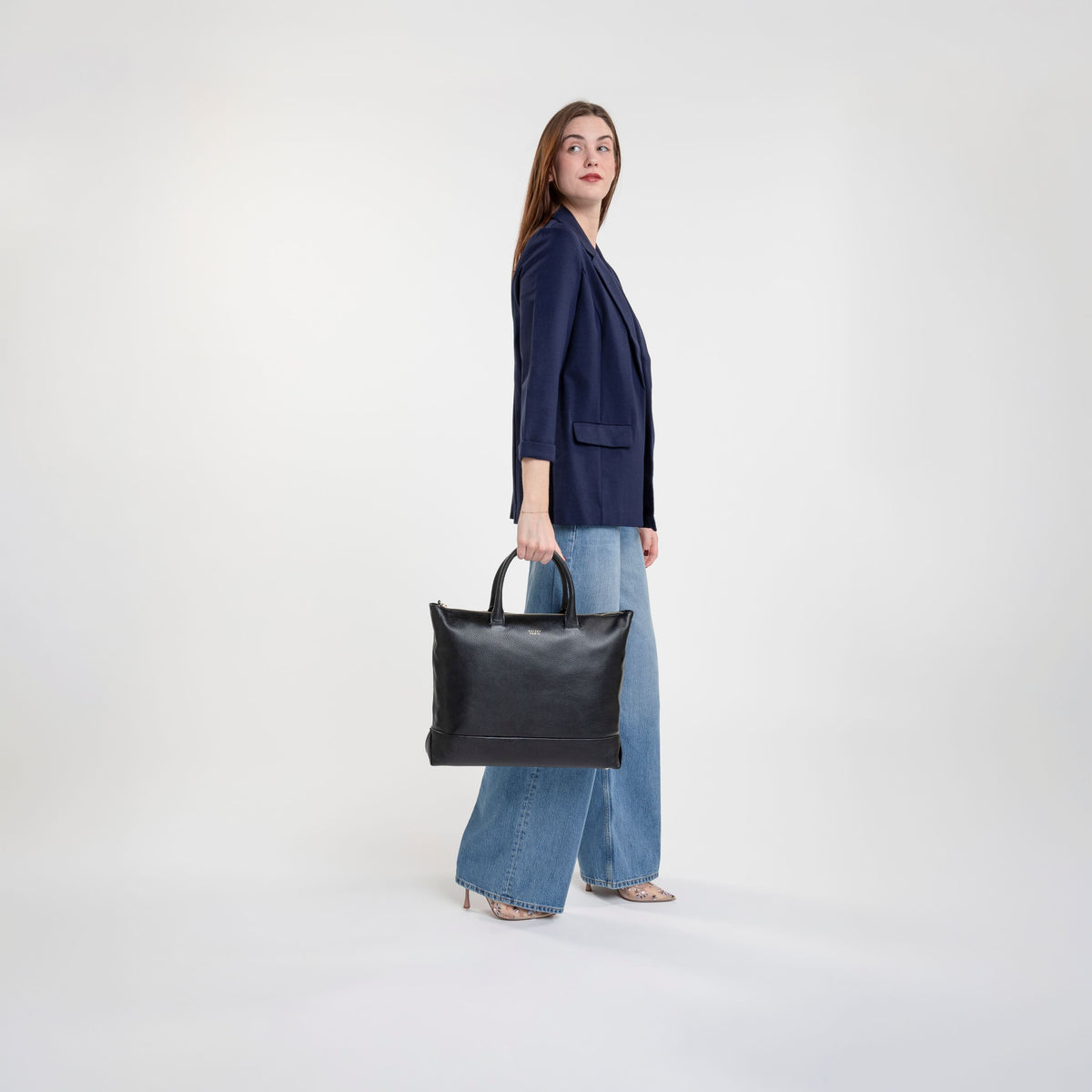 Delsey The Leather Collection Zippered Leather Tote Bag in Black — lifestyle
