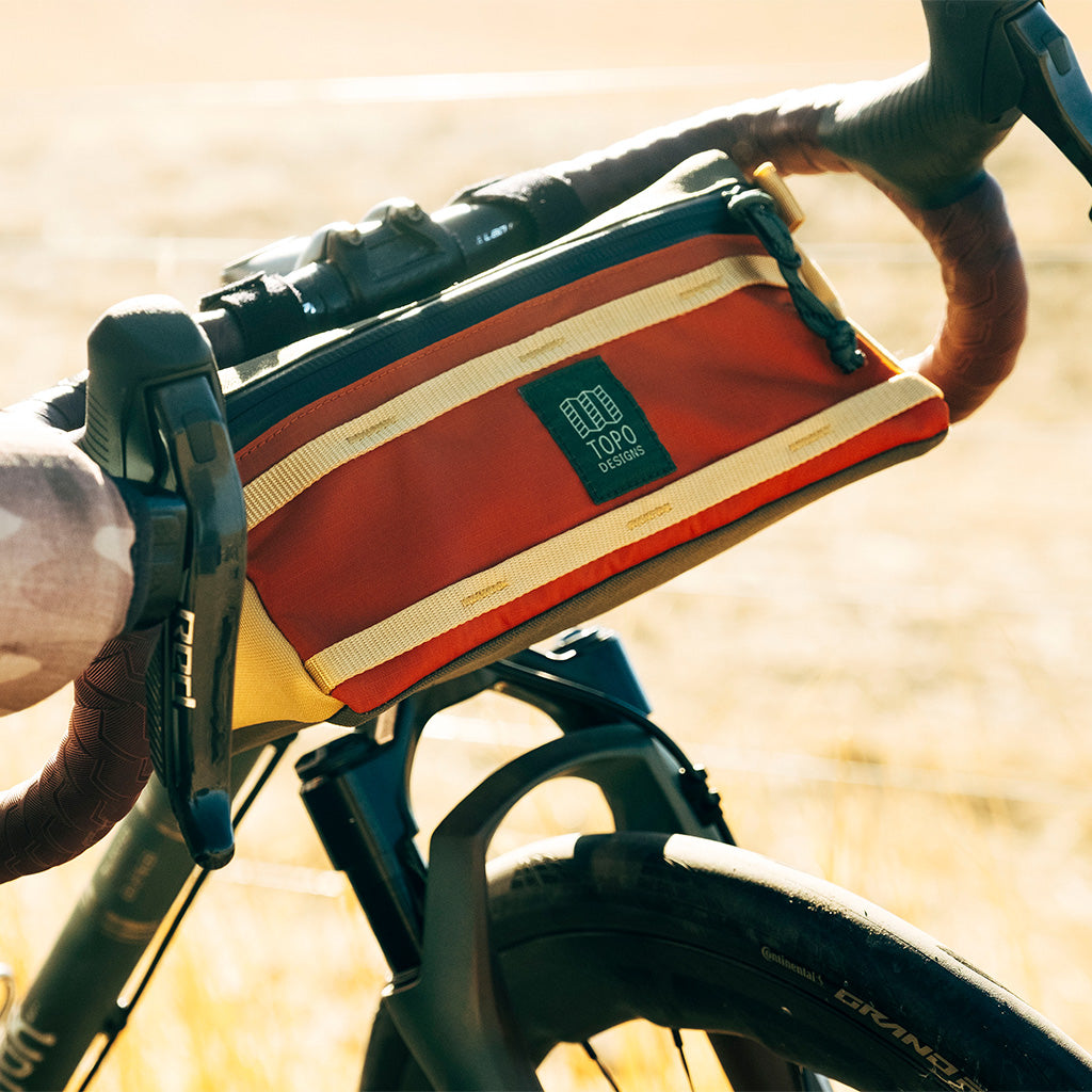 Topo Designs Bike Bag in Woodland Terracotta — angle view 2 # color_Woodland Terracotta