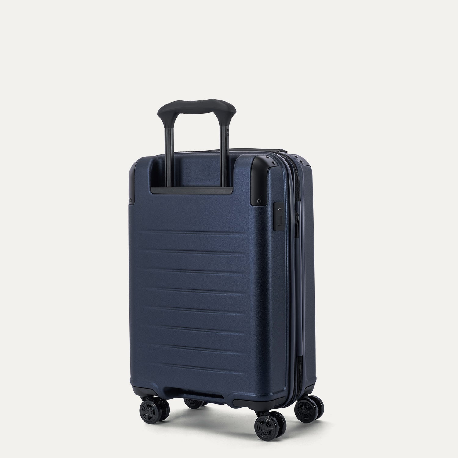 Travelpro Platinum Elite Hardside Compact Carry-On Expandable Spinner in Aviator Navy — back view