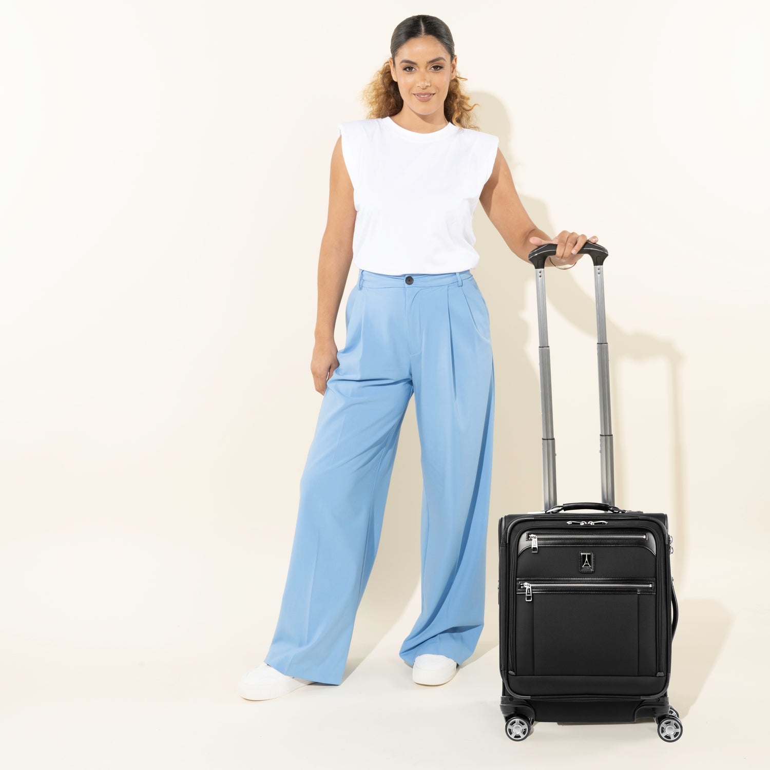 Travelpro Platinum Elite International Carry-On Expandable Spinner in Shadow Black — lifestyle