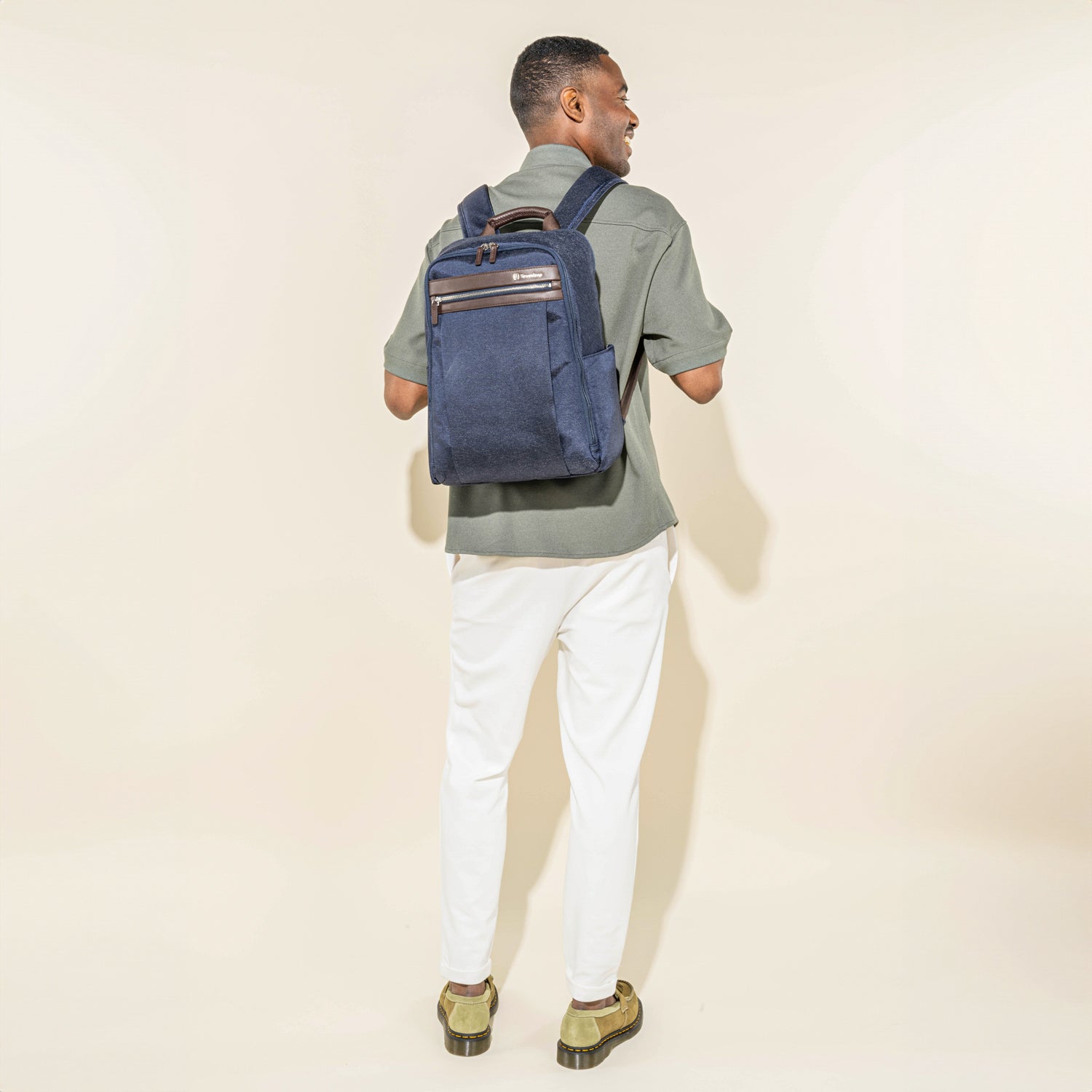 Travelpro Platinum Elite Slim Backpack in True Navy — lifestyle